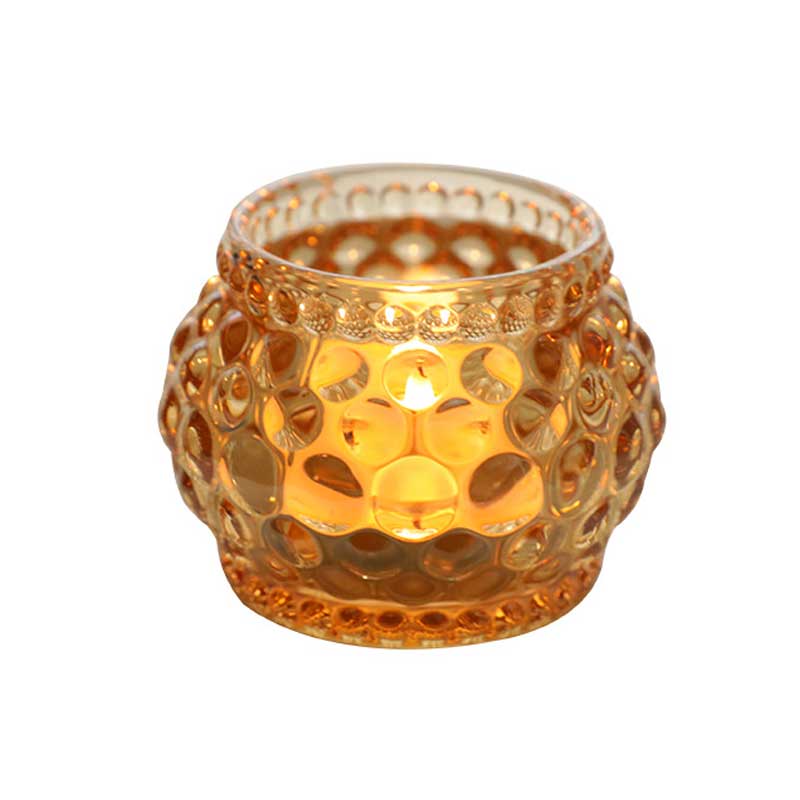 Amber glass sphere candle holder
